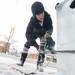 Washtenaw County Community College Culinary student Katie makes a sown man out of ice using a chainsaw during Saline's Winterfest Saturday Jan. 26th.Courtney Sacco I AnnArbor.com 